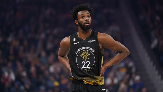 Warriors forward Andrew Wiggins (22) walks down the court during action against the Suns in the second quarter at the Chase Center.